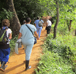Members of the Collaborative Sasha Health Initiative hike to survey households in Nicaragua.