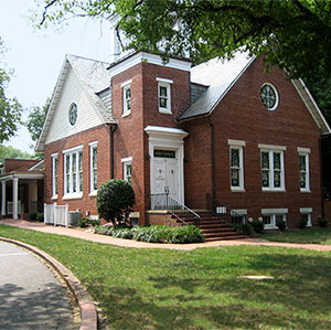 The Graduate Student Center, a brick building with stained glass windows.